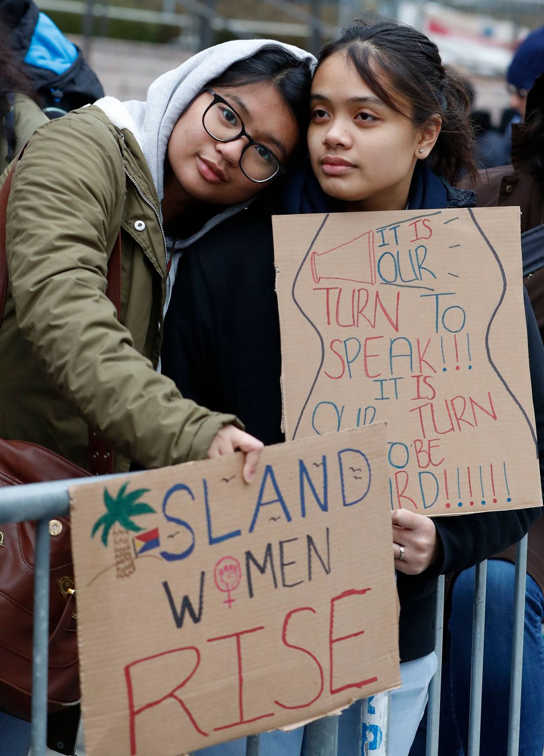 Two people at the rally (Kathy Willens/AP/Shutterstock)